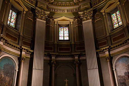 Interior of a church with stained glass and altar