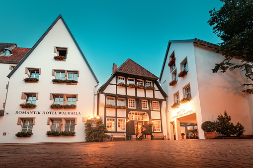 24 July 2022, Osnabruck, Germany: half-timbered architecture in the center of the old town of Osnabruck, now accommodating the Romantic Walhalla Hotel