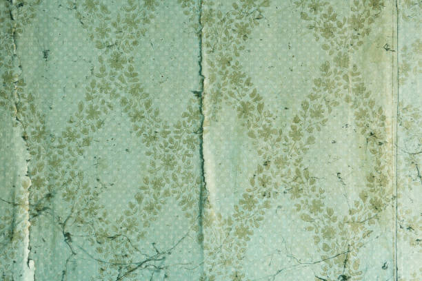 istock Old wallpaper on the wall. Old wallpaper for texture or background. 1435105427