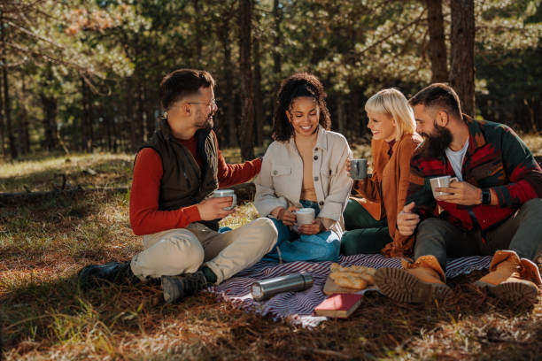 istock Friends on picnic in forest. 1435105807