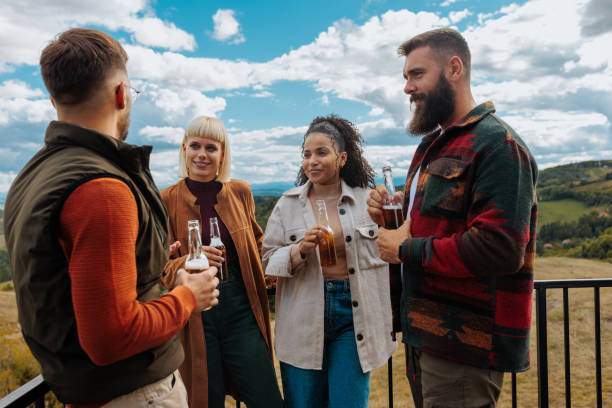 istock Friends having beers at mountain vacation. 1435106971