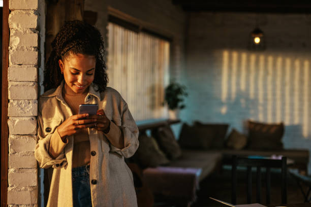 istock Woman using smartphone at home with copy space. 1435107663