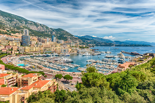 View over luxury yachts and apartments of Port Hercules in La Condamine district, city centre and harbour of Monte Carlo, Cote d'Azur, Principality of Monaco, iconic landmark of the French Riviera