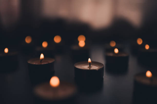 Burning scented Christmas candles in room closeup