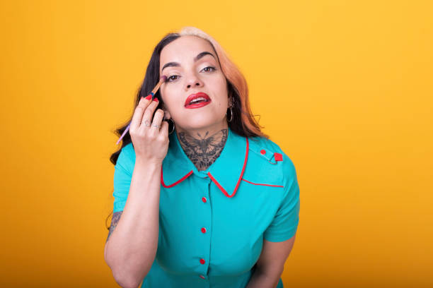 istock Attractive Woman Applying eye shadow 1435111605