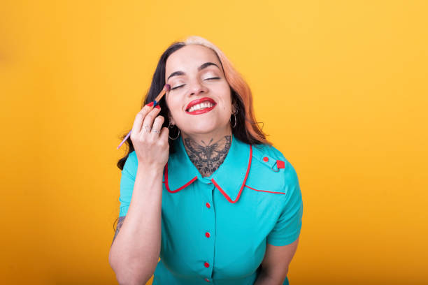 istock Attractive Woman Applying eye shadow 1435111610