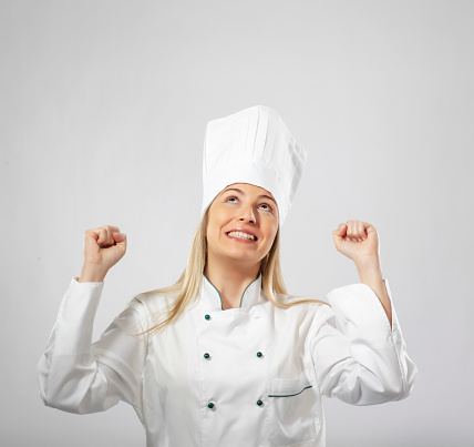 Female chef portrait cheering up on white background