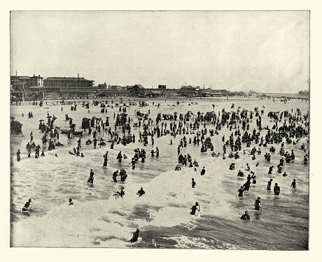 Vintage photograph of People in the sea and on the beach at Atlantic City, New Jersey, Victorian 19th Century
