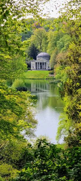 istock Temple by the lake with green vegetation 1435114773