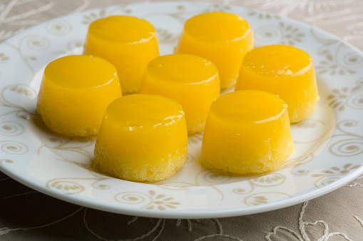 Quindim, delicious Brazilian baked dessert, it has an upturned cup format, and it is made of ground coconut, sugar, and egg yolks.