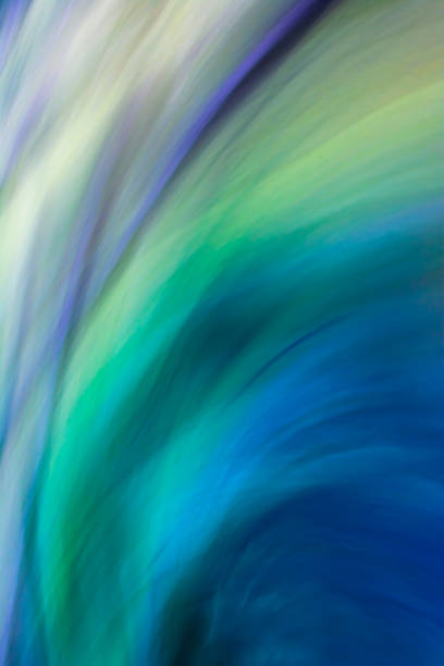 Vertical beautiful abstract multi-colored background in cold colors with green, blue, lilac waves with a gradient. Backdrop