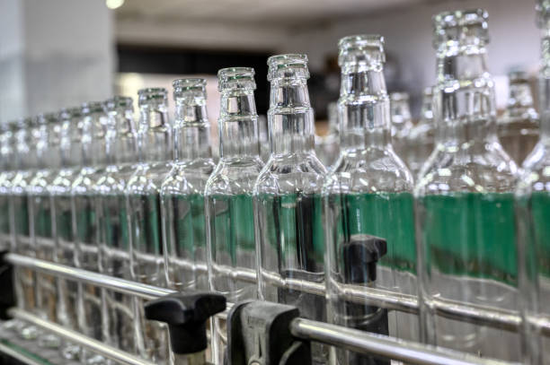 istock Row of glass bottles to fill with expensive alcohol drinks 1435119537