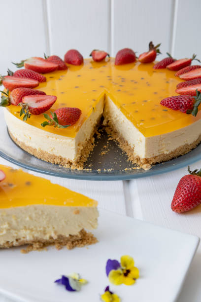 istock cake on a table cut a piece and served on a plate, pastry decoration with passion fruit, exquisite food 1435119910