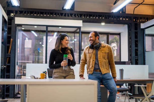 istock Coworkers are talking about work in the office 1435121511
