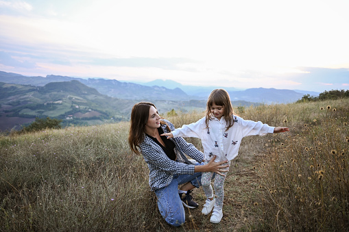 Mother and daughter relaxing outdoors