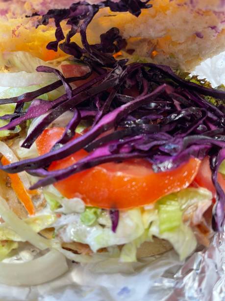 istock bread with lettuce, tomatoes, red cabbage, onions, close up 1435122650