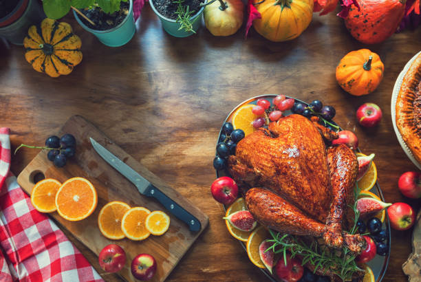 istock Preparing Stuffed Turkey with Side Dishes for Holidays 1435123294