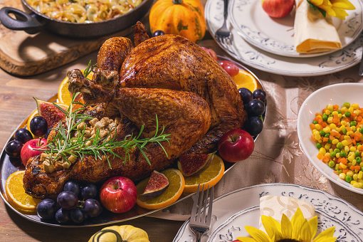 Traditional stuffed turkey with side dishes for Thanksgiving celebration