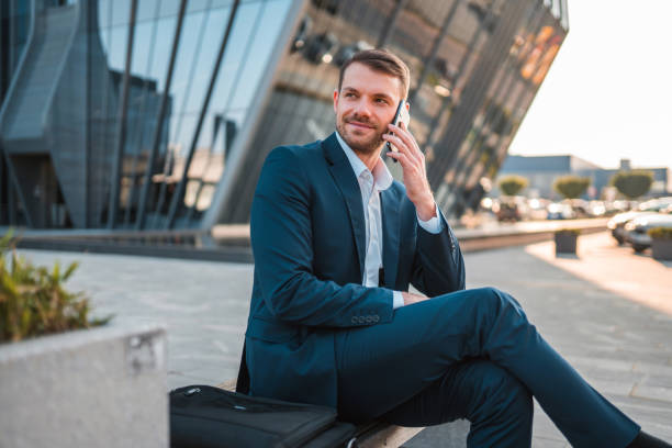 istock Handsome Caucasian Businessman Using A Smart Phone Outdoors In The City 1435123836