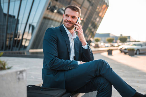 istock Handsome Caucasian Businessman Using A Smart Phone Outdoors In The City 1435123845
