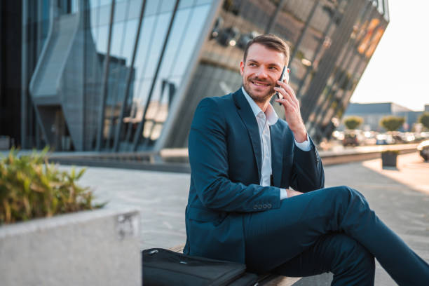 istock Handsome Caucasian Businessman Using A Smart Phone Outdoors In The City 1435123850