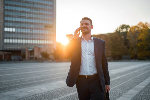 istock Handsome Caucasian Businessman Using A Smart Phone Outdoors In The City 1435123994