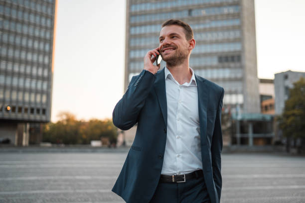 istock Handsome Caucasian Businessman Using A Smart Phone Outdoors In The City 1435124004