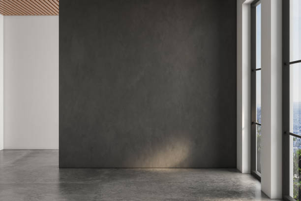 istock Realistic 3D rendering of empty room, beautiful sunlight and window frame shadow on black blank wall, white wall. concrete floor, wooden ceiling. Background, Interior. Front view.Mock up. 1435125488