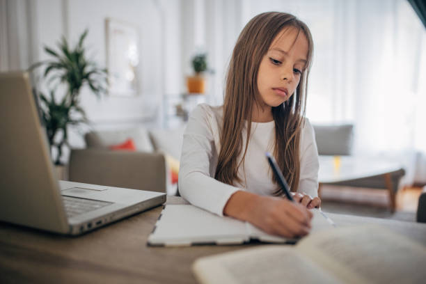 istock Cute girl studying 1435130518