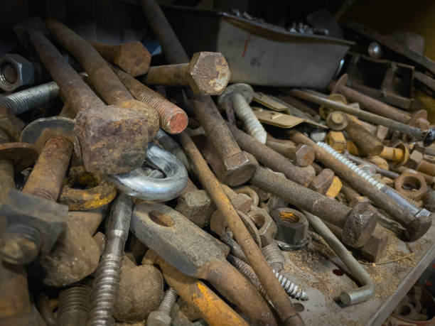 istock old, used, rusty, bolts, screws, spikes, hooks, nuts, odds-and-ends on shelf in workshop working with old parts and pieces 1435132183