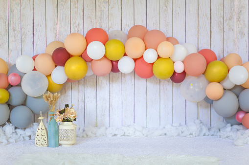 party background with colorful streamers for celebrating birthday. space with scattered confetti. Colorful celebration concept. Copy space on blue background