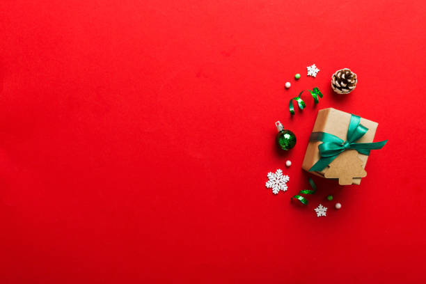 istock Top view Flat lay Christmas decorations and gift box on colored background with copy space. Christmas or Happy New Year composition 1435138211
