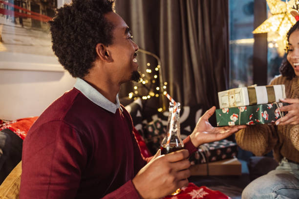 istock Christmas gift exchange at home 1435140209