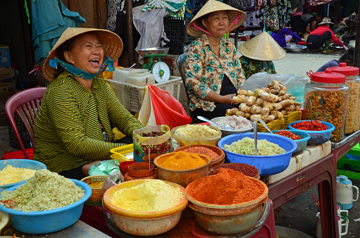 Hi Chi Minh City, Vietnam - July 31, 2017: women street food vendors with spices at market