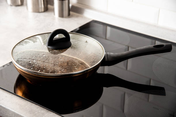 istock Frying pan in modern kitchen with induction stove 1435144414