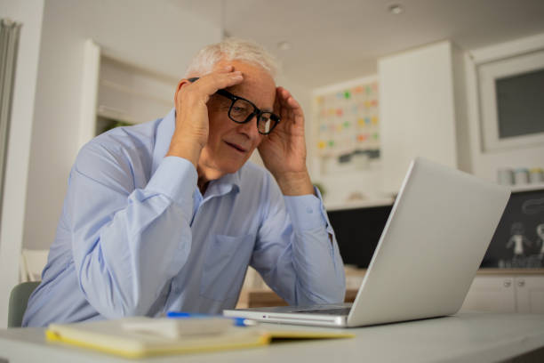 istock Businessman looking busy working from home 1435148101