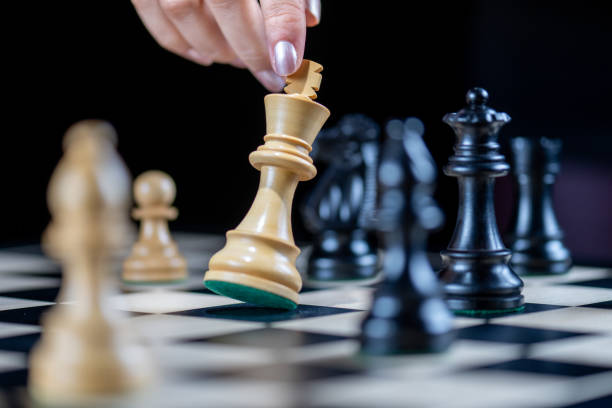 istock Laying down white king after losing chess game 1435151211