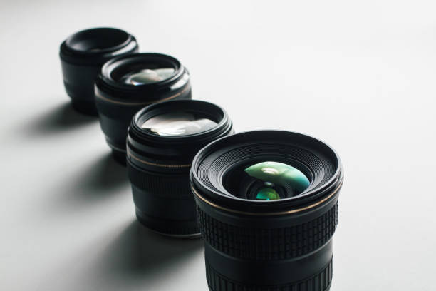 istock close-up view of a group of camera lenses on a white surface 1435151223