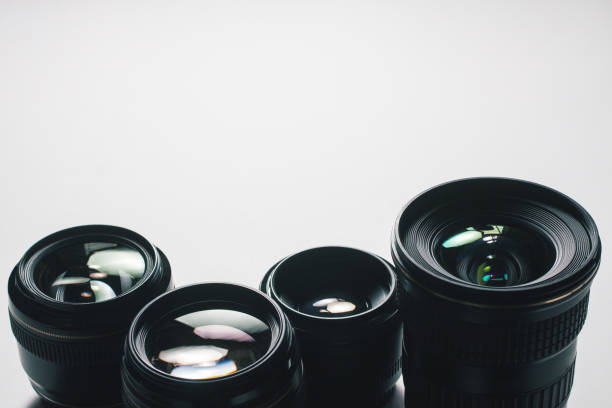 istock close-up view of a group of camera lenses on a white surface 1435151226