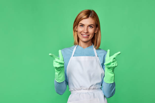 istock woman in gloves pointing fingers at copy space 1435151821