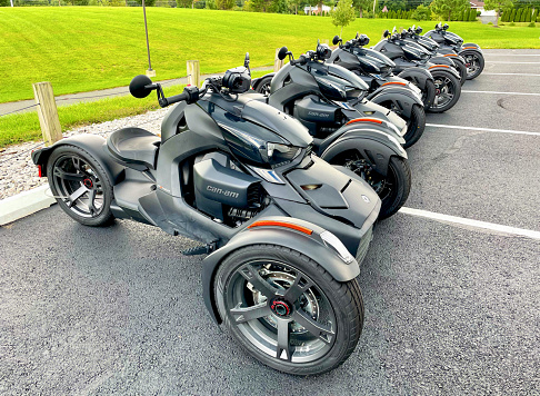 Fairfax, Virginia, USA - September 26, 2022: A row of Can-Am Ryker Sport 3-Wheel Vehicles is lined up together in a parking lot at George Mason University’s West Campus.
