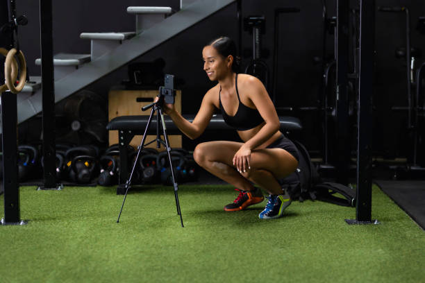 istock Young person recording a video at gym 1435161138