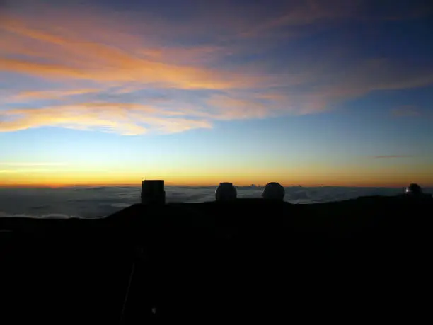 This shot is the scene around the summit of Mauna kea in Hawaii Island. In the twilight, we can see a grand and colorful sky. This spot is extremely cold.