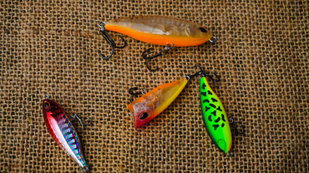 istock Artificial lure made from plastic for fishing by casting. Casting lure with hook with blur background, Artificial lure with the shape of minnow - Selected Focus 1435162376
