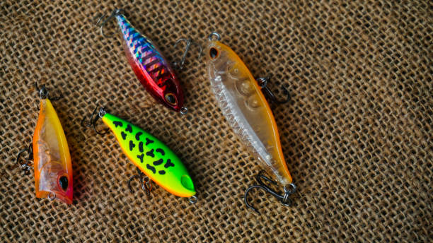 istock Artificial lure made from plastic for fishing by casting. Casting lure with hook with blur background, Artificial lure with the shape of minnow - Selected Focus 1435162411