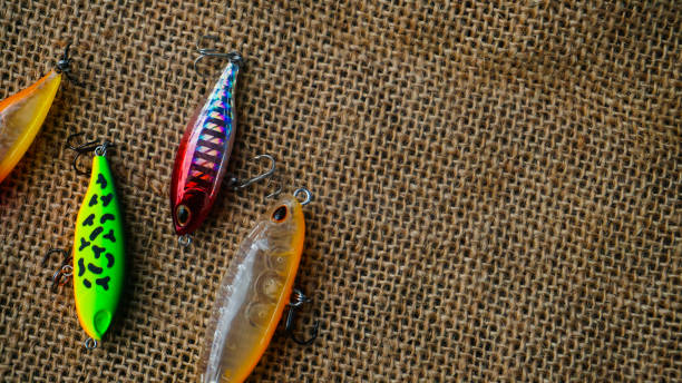 istock Artificial lure made from plastic for fishing by casting. Casting lure with hook with blur background, Artificial lure with the shape of minnow - Selected Focus 1435162432