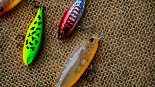 istock Artificial lure made from plastic for fishing by casting. Casting lure with hook with blur background, Artificial lure with the shape of minnow - Selected Focus 1435162514
