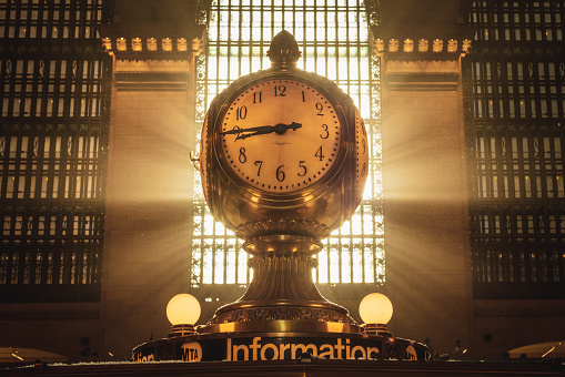 Grand Central Station New York indoors yellow Clock with Timetables and scoreboard in the background, view from low angle