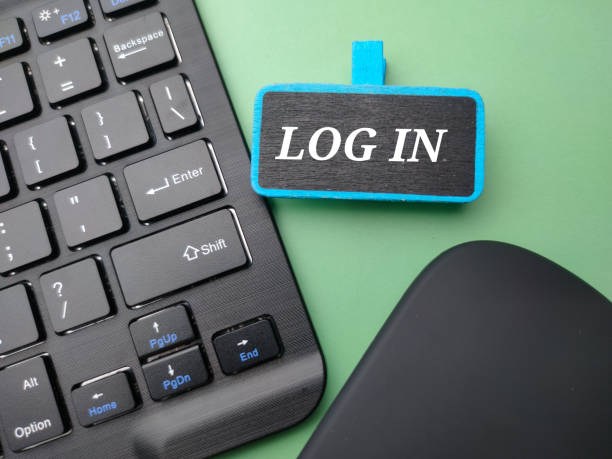 istock Wireless keyboard and mouse with the word LOG IN on green background. 1435177260
