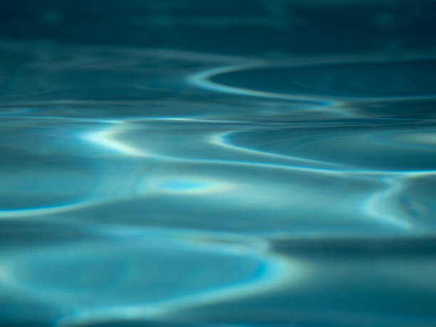 istock Aquamarine Colored Swimming Pool Water with Gentle Ripples 1435183352